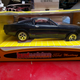 An oddly proportioned Mustang that I painted a gold stripe on.
